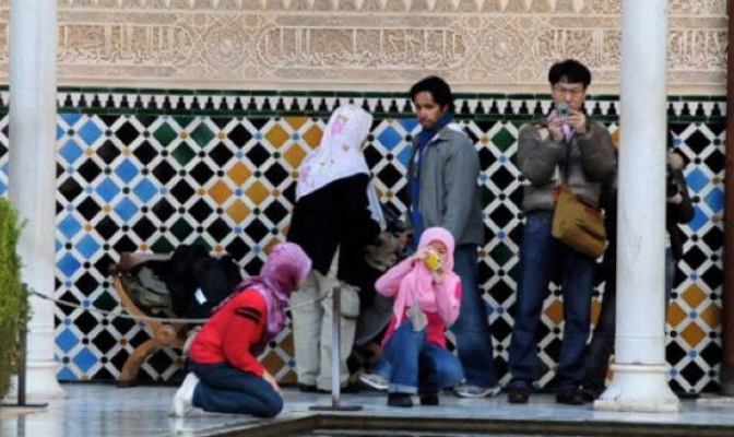 Muslim tourists in the Alhambra, Granada.
