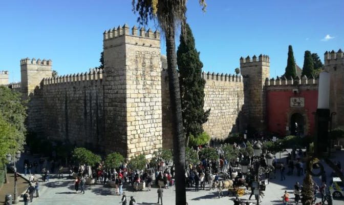 Puerta del León entrance and outer walls of the Royal Alcázar of Seville, a historic palace complex of Islamic origin in Seville, Spain.