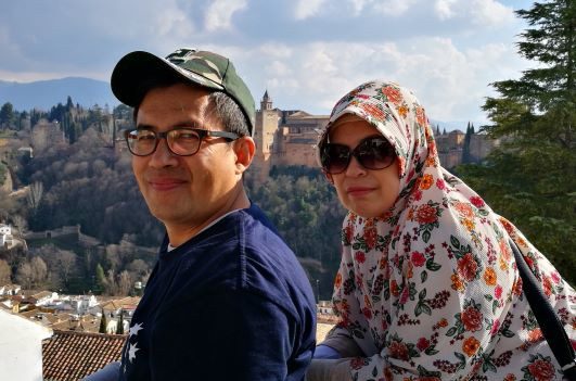 Malaysian couple at the Mirador de San Nicolás overlooking the Alhambra in Granada