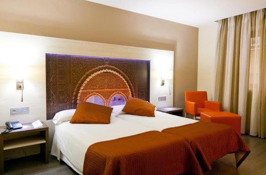 Hotel room in Granada decorated with an image of the Alhambra