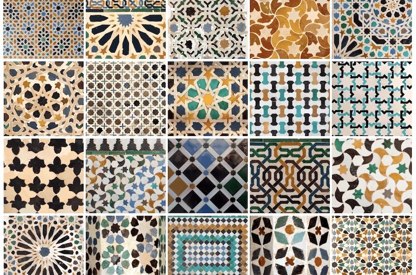 Intricate geometric patterns in the decorative tile mosaics on the walls of the Alhambra in Granada, Spain.