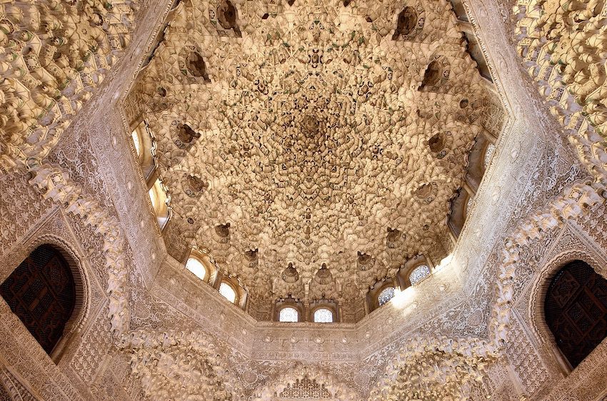 Intricate muqarnas dome decorating the ceiling of the Hall of the Two Sisters in the Alhambra, Granada, Spain.
