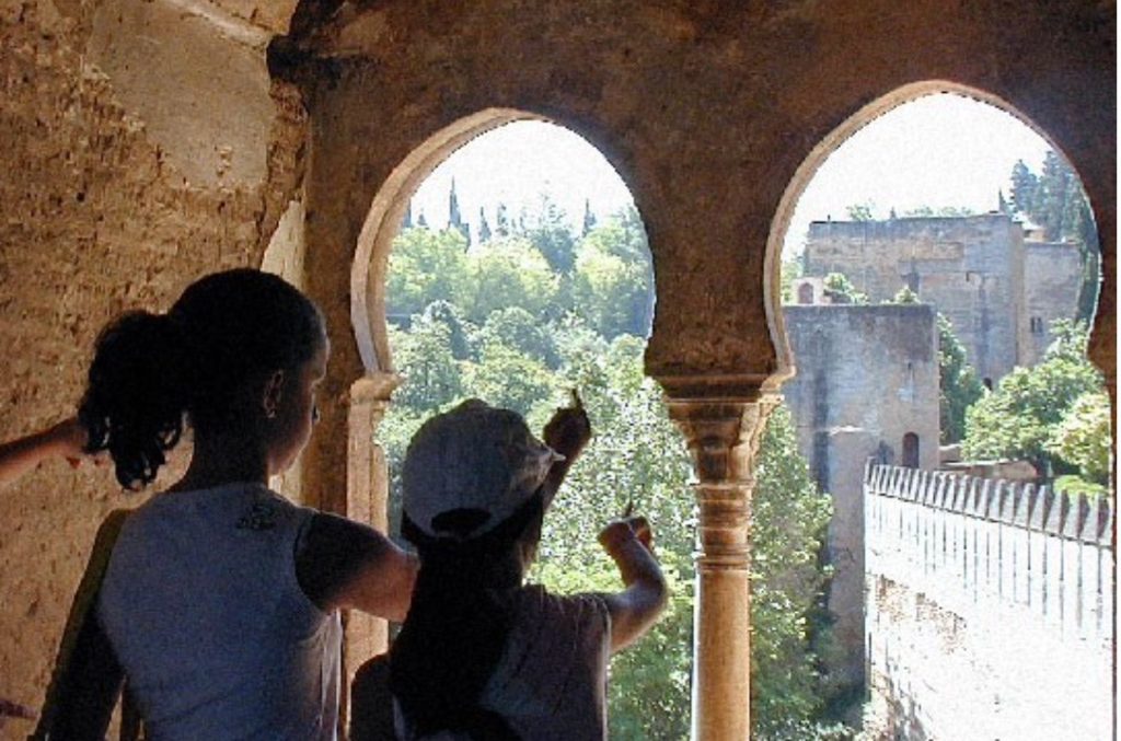 Two young girls exploring the Alhambra in Granada, Spain.