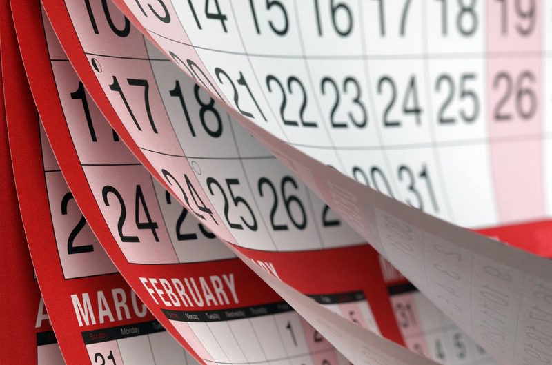 Calendar pages illustrating the 12-month advance booking period for Alhambra tickets.
