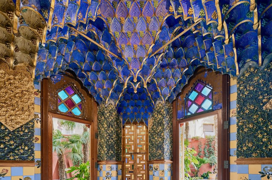 Ornate Islamic-inspired ceiling with muqarnas-style plasterwork in the Smoking Room of Casa Vicens, designed by Antoni Gaudí in Barcelona.